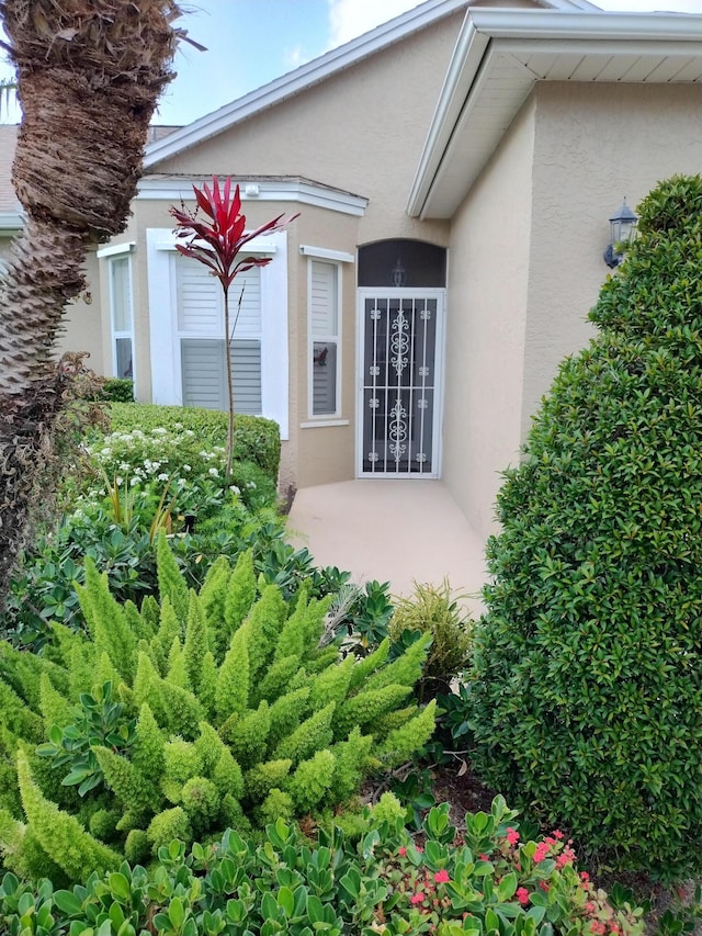 1047 NW Tuscany Dr, Port Saint Lucie, FL 34986 - entrance to property with stucco siding