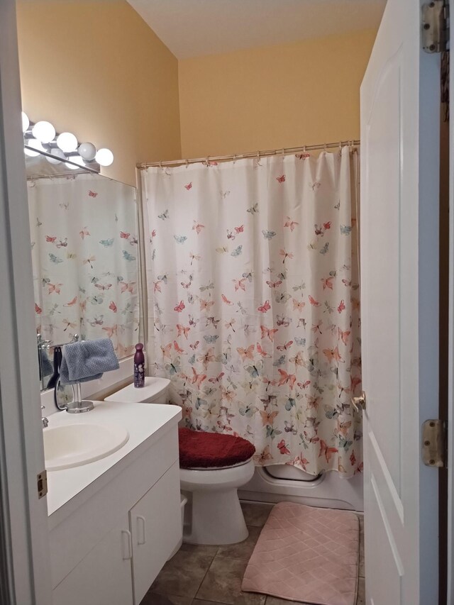 1047 NW Tuscany Dr, Port Saint Lucie, FL 34986 - bathroom featuring tile patterned floors, toilet, shower / tub combo with curtain, and vanity