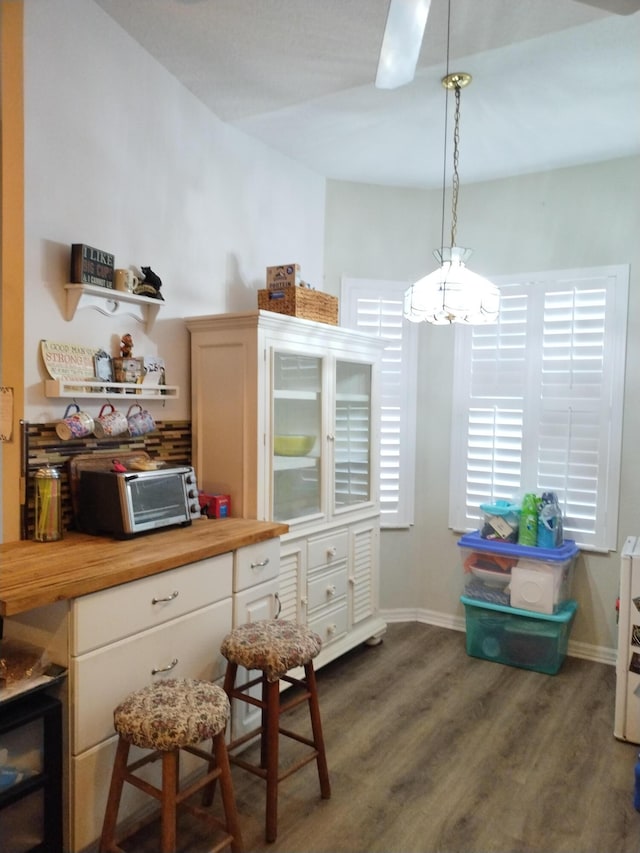 1047 NW Tuscany Dr, Port Saint Lucie, FL 34986 - interior space with baseboards and dark wood-type flooring