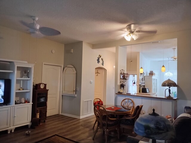 1047 NW Tuscany Dr, Port Saint Lucie, FL 34986 - dining room featuring a textured ceiling, visible vents, ceiling fan, and dark wood-style flooring
