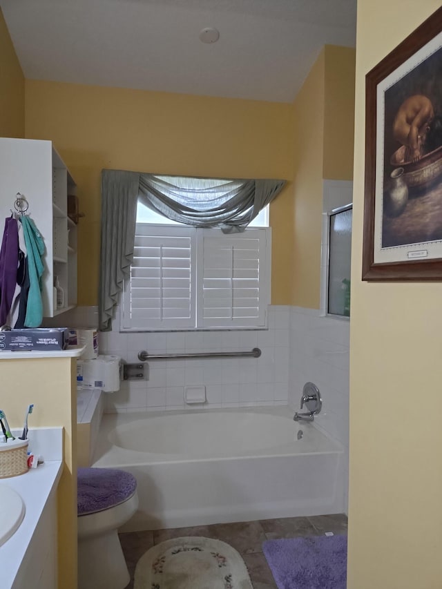 1047 NW Tuscany Dr, Port Saint Lucie, FL 34986 - bathroom featuring toilet, a shower, vanity, a washtub, and tile patterned flooring