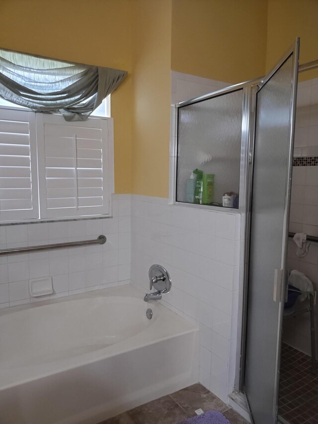 1047 NW Tuscany Dr, Port Saint Lucie, FL 34986 - full bath featuring a stall shower, tile patterned floors, and a garden tub