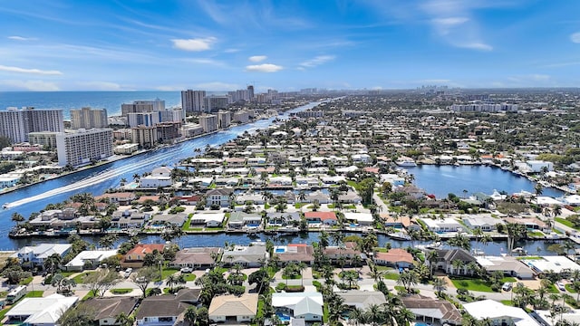view of urban area featuring a nearby body of water and nearby suburban area