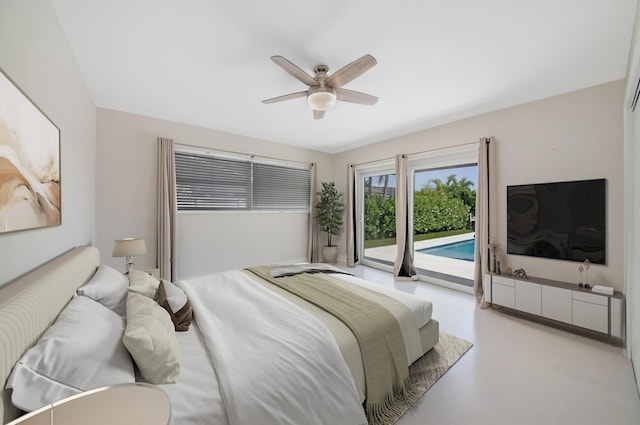 bedroom with access to outside, ceiling fan, and concrete flooring