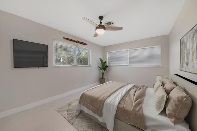 bedroom with baseboards and ceiling fan