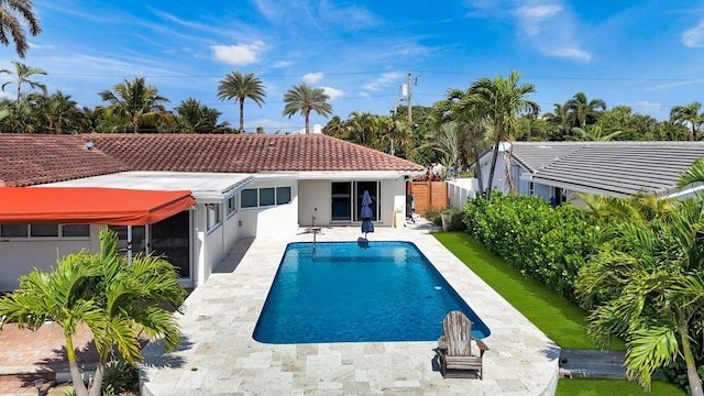swimming pool featuring a fenced backyard and a patio area