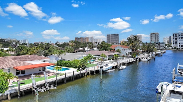 view of urban area featuring a nearby body of water
