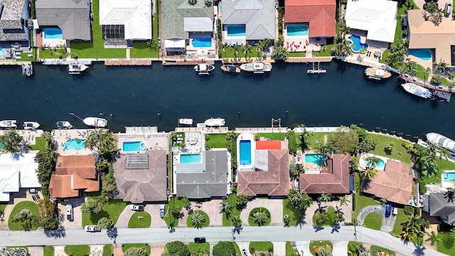 aerial overview of property's location featuring a large body of water and nearby suburban area