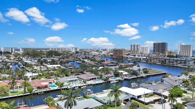 view of urban area featuring a large body of water and nearby suburban area