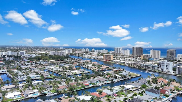 view of urban area featuring a nearby body of water