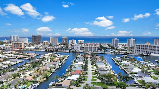 view of urban area featuring a nearby body of water