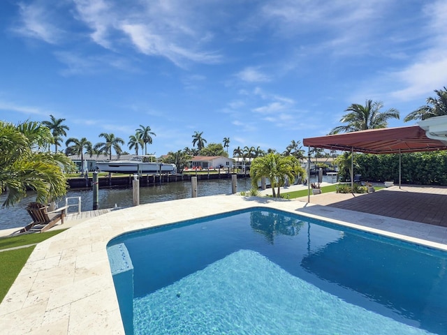 swimming pool with a water view and a boat dock