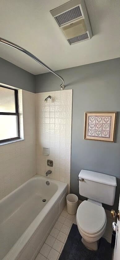 163 Pinto Palm Ct Unit 02, Royal Palm Beach, FL 33411 - bathroom featuring tile patterned floors, toilet, and washtub / shower combination