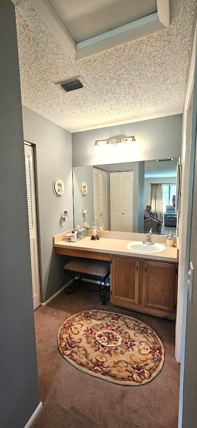 163 Pinto Palm Ct Unit 02, Royal Palm Beach, FL 33411 - bathroom with vanity and a textured ceiling