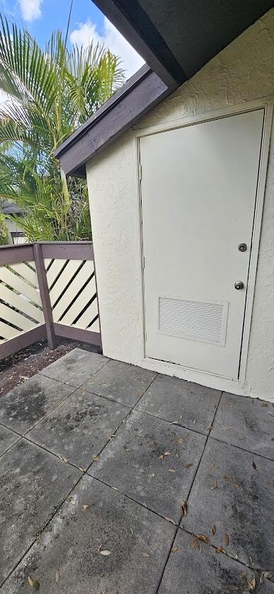 163 Pinto Palm Ct Unit 02, Royal Palm Beach, FL 33411 - property entrance with stucco siding
