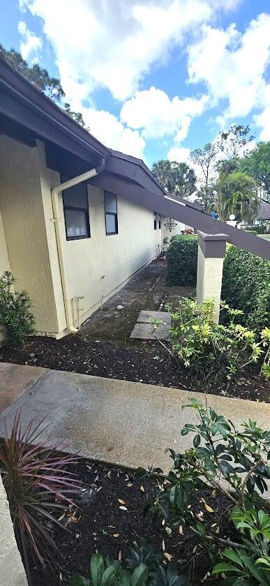 163 Pinto Palm Ct Unit 02, Royal Palm Beach, FL 33411 - view of side of property with stucco siding