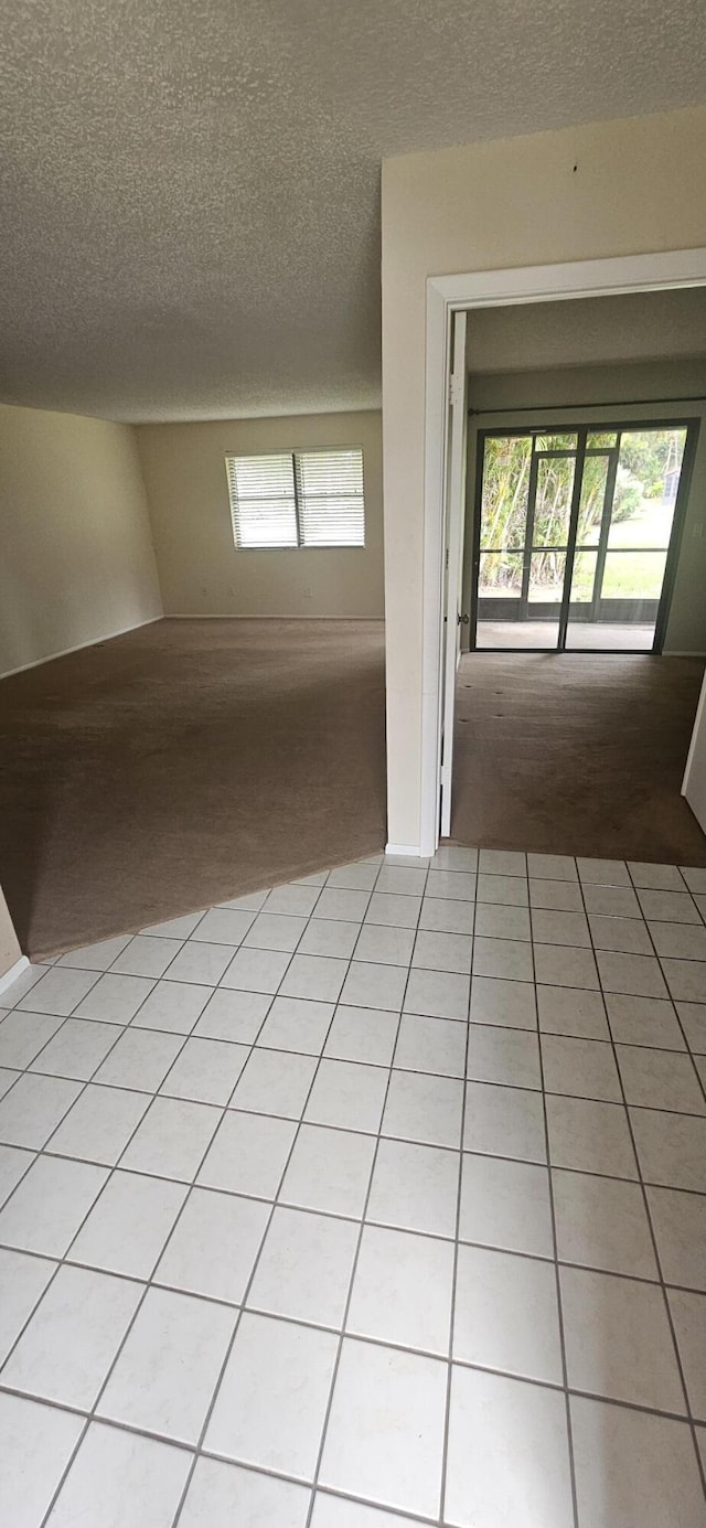 163 Pinto Palm Ct Unit 02, Royal Palm Beach, FL 33411 - spare room with light colored carpet and a textured ceiling