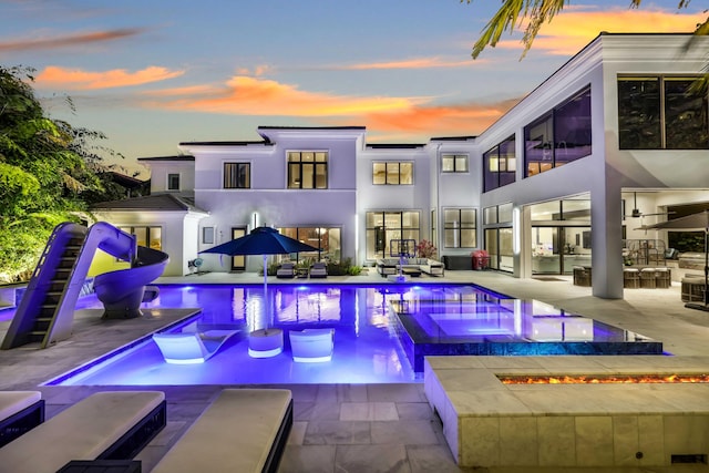 8388 Del Prado Dr, Delray Beach, FL 33446 - view of pool featuring a patio area and a pool with connected hot tub