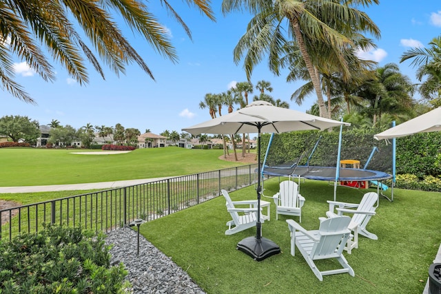 8388 Del Prado Dr, Delray Beach, FL 33446 - view of yard featuring a trampoline and view of golf course