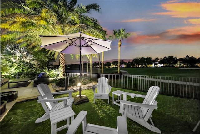 8388 Del Prado Dr, Delray Beach, FL 33446 - yard at dusk with a patio area