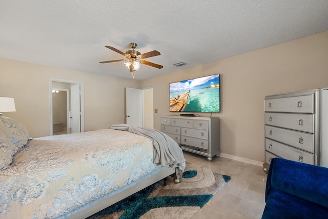bedroom with a textured ceiling, baseboards, ceiling fan, and visible vents