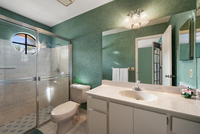 bathroom featuring vanity, toilet, an inviting chandelier, and a shower stall