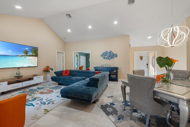 living area with high vaulted ceiling, visible vents, a chandelier, and recessed lighting