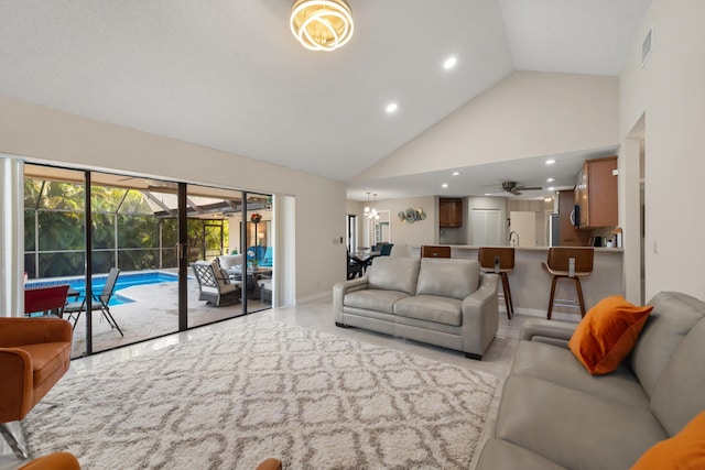 living area featuring high vaulted ceiling, a sunroom, baseboards, visible vents, and ceiling fan