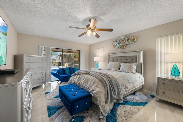 bedroom featuring a textured ceiling, access to exterior, baseboards, and a ceiling fan