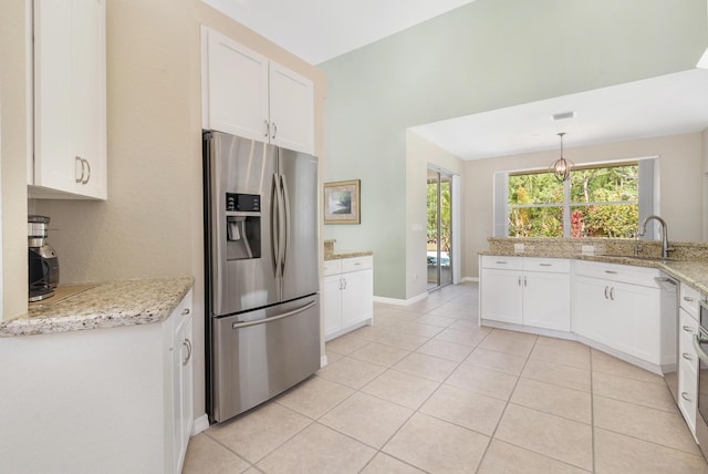 kitchen featuring white cabinets, a sink, and stainless steel fridge with ice dispenser