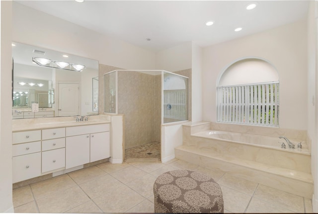full bathroom with tile patterned floors, vanity, a stall shower, and a bath