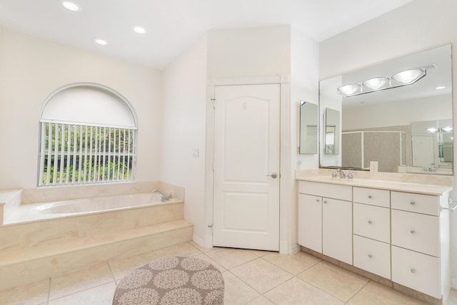 full bath with a bath, tile patterned floors, vanity, and a shower stall
