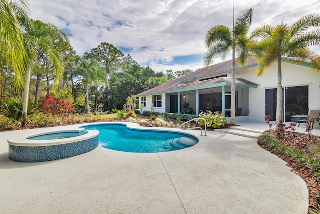 view of pool featuring a pool with connected hot tub and a patio