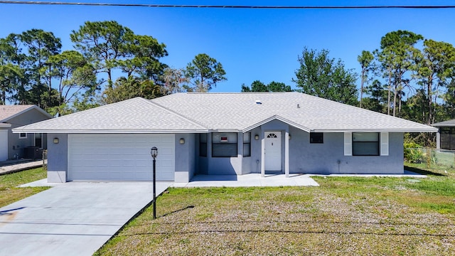 ranch-style house with stucco siding, an attached garage, central AC, and concrete driveway