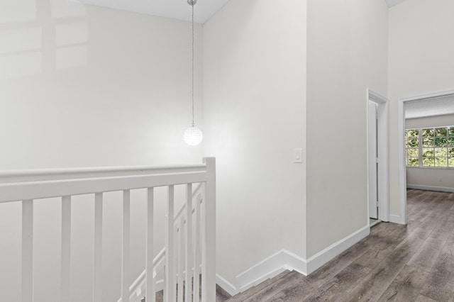 9448 Boca River Cir, Boca Raton, FL 33434 - hall with baseboards, an upstairs landing, wood finished floors, and a towering ceiling