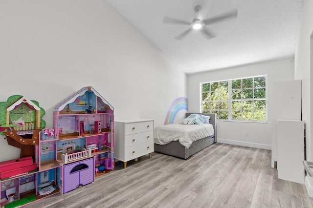 9448 Boca River Cir, Boca Raton, FL 33434 - bedroom featuring vaulted ceiling, baseboards, a textured ceiling, ceiling fan, and wood finished floors