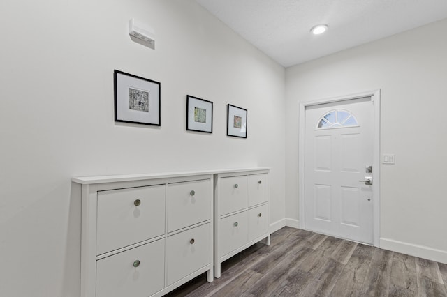 9448 Boca River Cir, Boca Raton, FL 33434 - foyer entrance with baseboards and wood finished floors