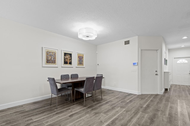 9448 Boca River Cir, Boca Raton, FL 33434 - dining area with baseboards, visible vents, and wood finished floors