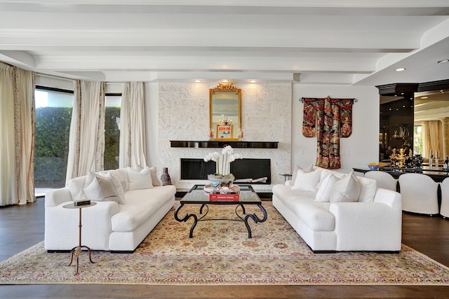 living room with recessed lighting, a fireplace, beam ceiling, and wood finished floors