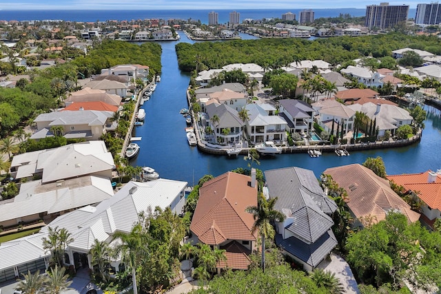 drone / aerial view featuring a residential view and a water view