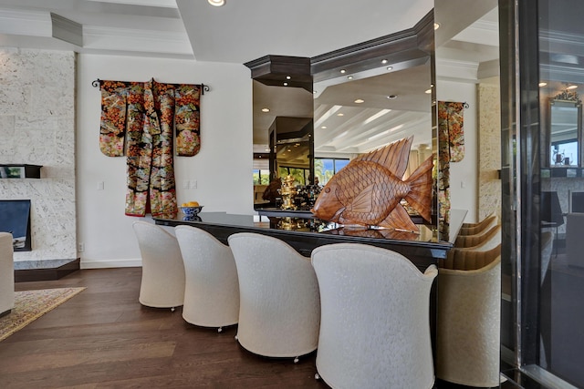 dining area featuring baseboards, a high end fireplace, crown molding, recessed lighting, and wood finished floors