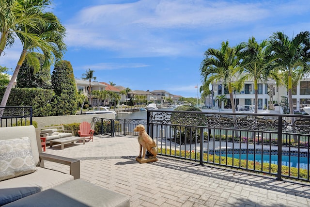 view of patio with a water view and a residential view