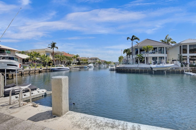 view of dock featuring a water view and a residential view
