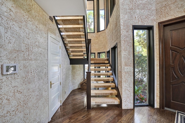 foyer featuring stairs and hardwood / wood-style floors