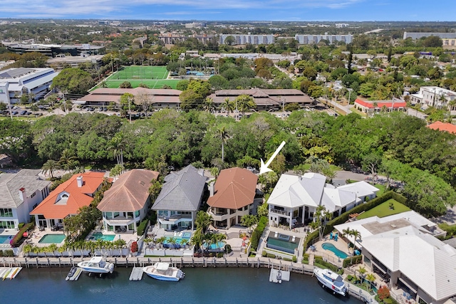 drone / aerial view with a residential view and a water view