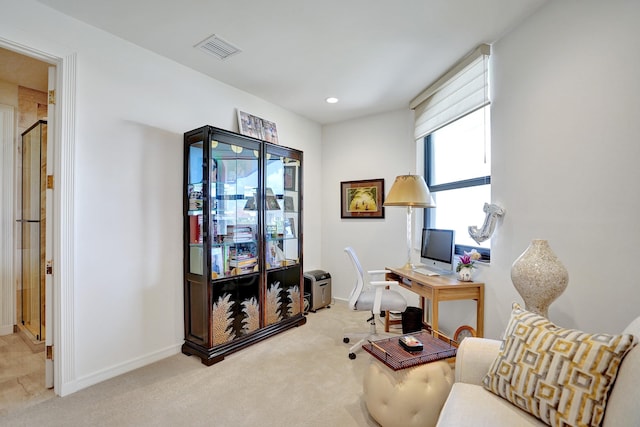 office space featuring light carpet, baseboards, visible vents, and recessed lighting