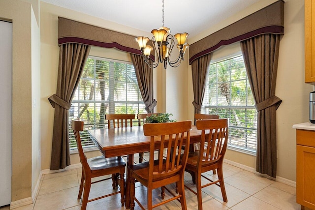 9686 SW Glenbrook Dr, Port Saint Lucie, FL 34987 - dining area featuring plenty of natural light, light tile patterned floors, and an inviting chandelier