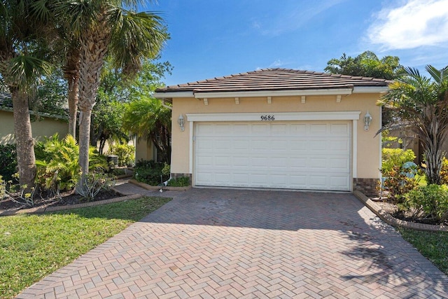 9686 SW Glenbrook Dr, Port Saint Lucie, FL 34987 - garage with decorative driveway