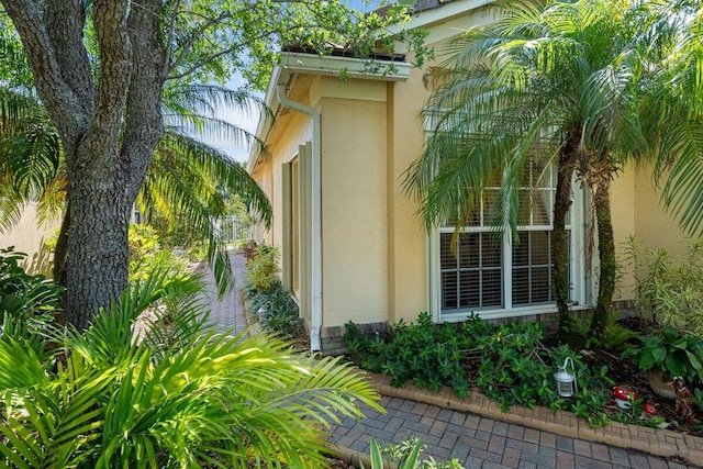 9686 SW Glenbrook Dr, Port Saint Lucie, FL 34987 - view of side of property with stucco siding