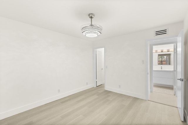361 Normandy H, Delray Beach, FL 33484 - spare room featuring light wood-type flooring and baseboards